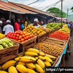 Home 19 코모로 대표 음식 목록 - A vibrant street market scene in the Comoros islands featuring colorful stalls overflowing with fres...